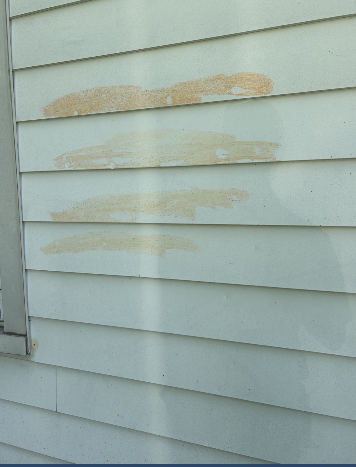 Metal siding damage from 1.5 inch hail