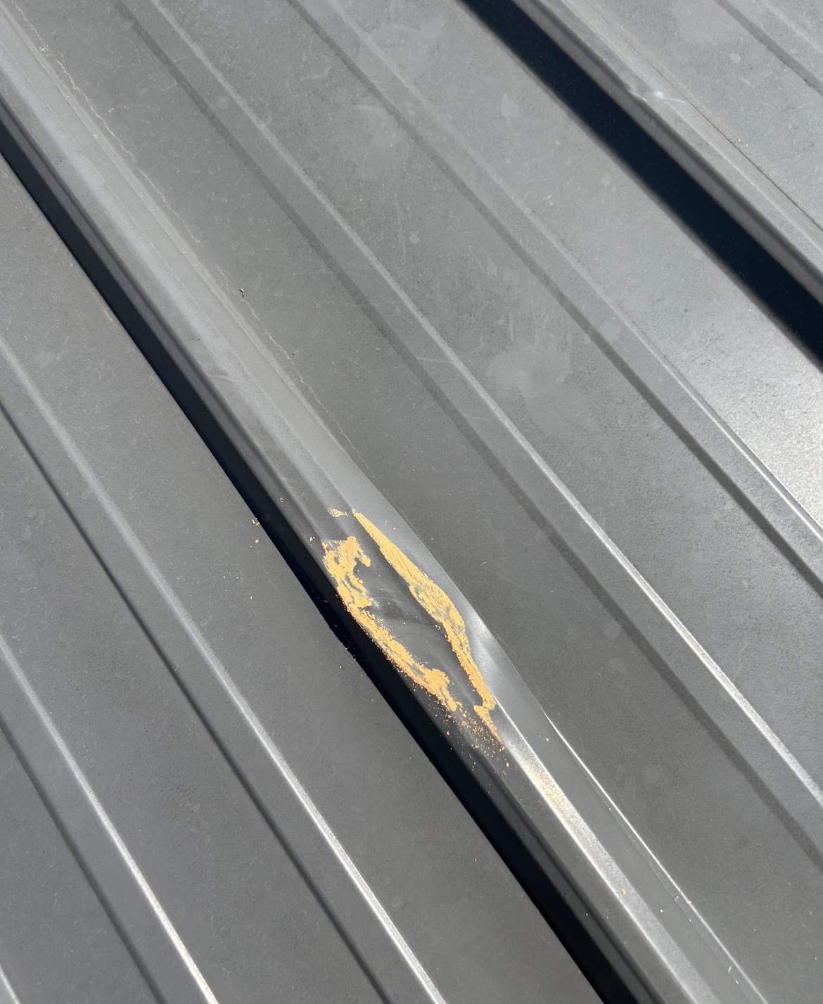 Metal roof damage from 2 inch hail
